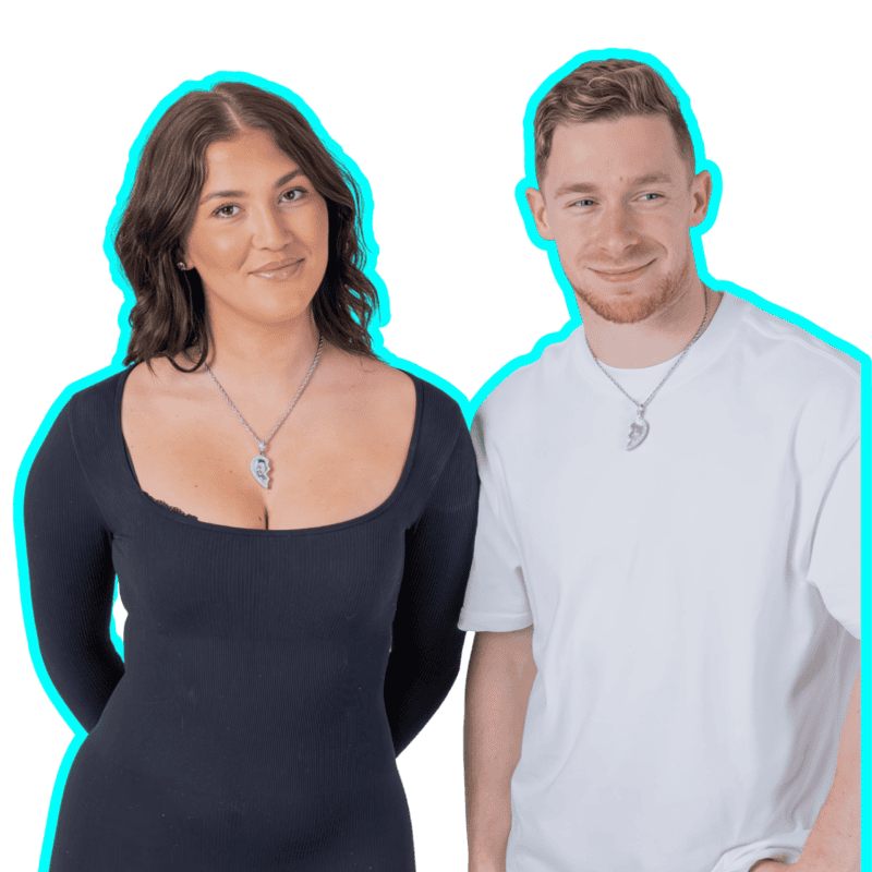 Couple wearing broken heart necklace with blue outline.